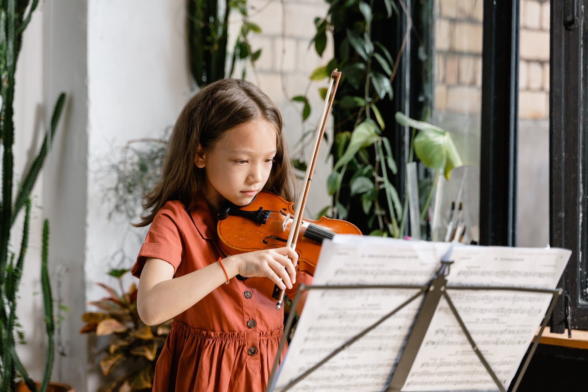 a diligent girl playing violin